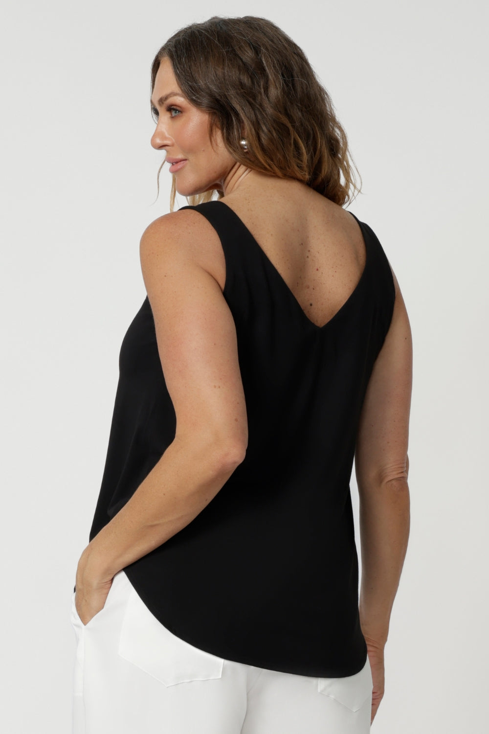 Woman's summer cami features a graceful V-neckline both in the front and the back, adding a touch of sophistication and subtle femininity to the overall look. Summer ready top is available in sizes 8-24. Fashion brand Leina & Fluer proudly stock petite and plus sizes.