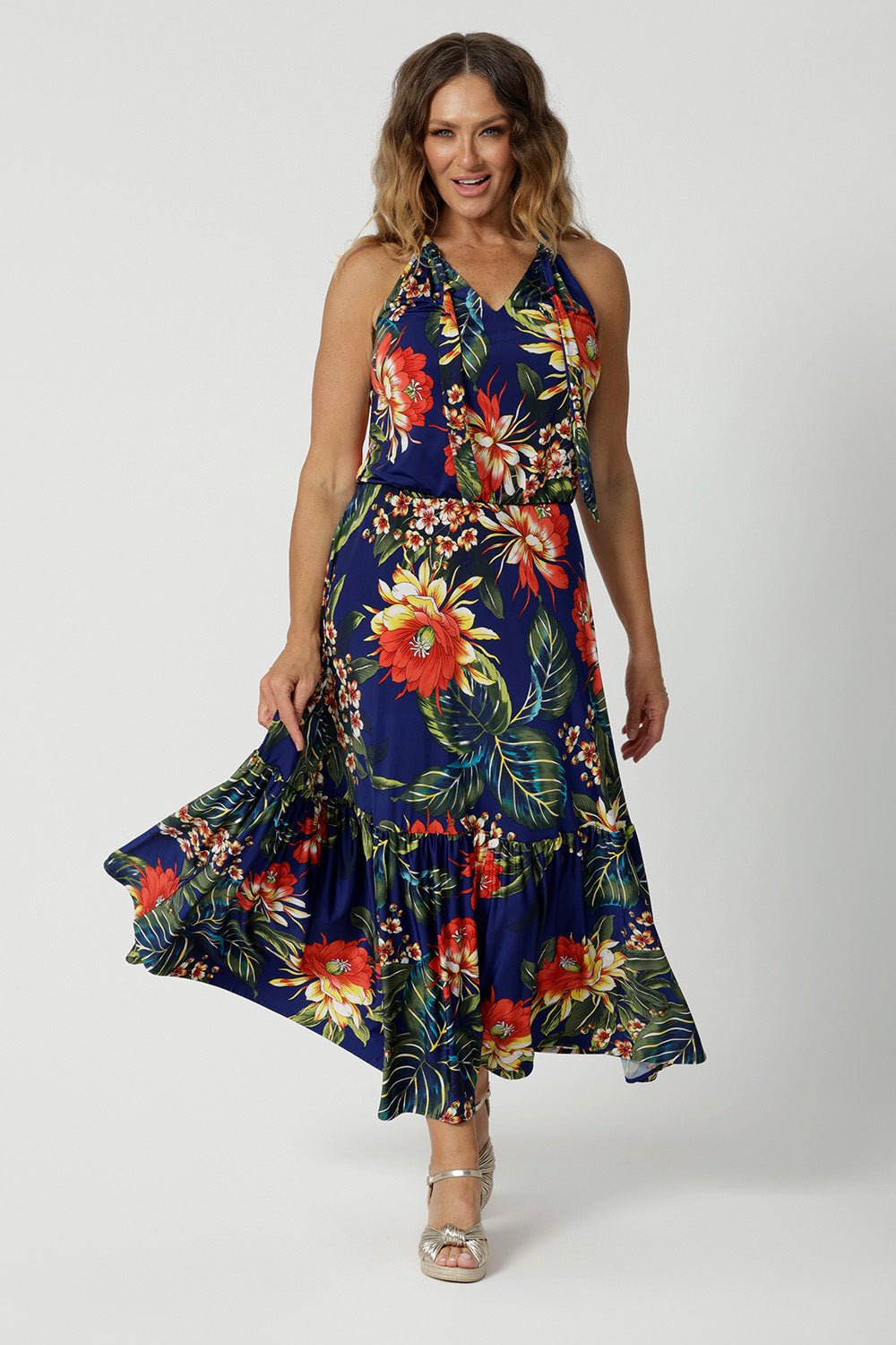 Size 12 model wears summer ready dress. Maxi Dress is made of Comfortable and easy care fabric. Dress is Australian made for women size 8-24. Leina & Fleur is a woman's fashion brand that stocks petite and plus sizes.