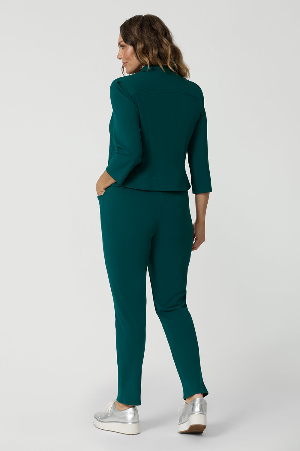 A backview of a great workwear jacket for women over 40, the Benni 3/4 sleeve jacket is worn with tapered leg green workwear pants.
A cropped green jacket , it makes a good workwear suit for women. In sizes 8 to 24, this women's jacket is made in Australia for petite to plus size women. So if you're looking for workwear outfits for curvy women, shop online at Leina & Fleur!