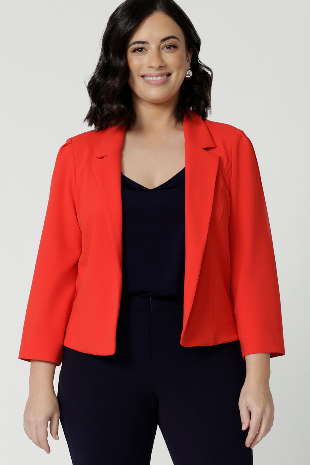 The Benni Jacket is a standout piece that effortlessly transitions through the seasons, designed with a flattering open-front style and a narrow collar with notch lapels for a sharp, refined look.