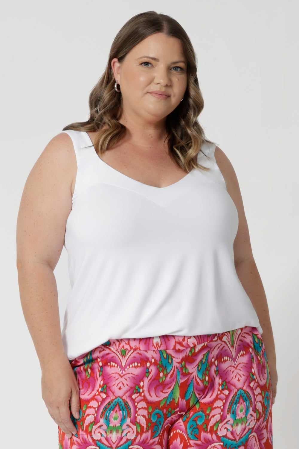 This summer cami for women from Leina & Fleur, a plus-size inclusive fashion brand, is the perfect blend of style, comfort, and versatility. Made from a luxurious bamboo fabric with stretch, it offers a smooth, soft feel against the skin while ensuring breathability and all-day comfort—ideal for warm summer days. The fabric's stretch allows for a flattering fit that moves with you, giving you both freedom and support. Sizes from 8-24.