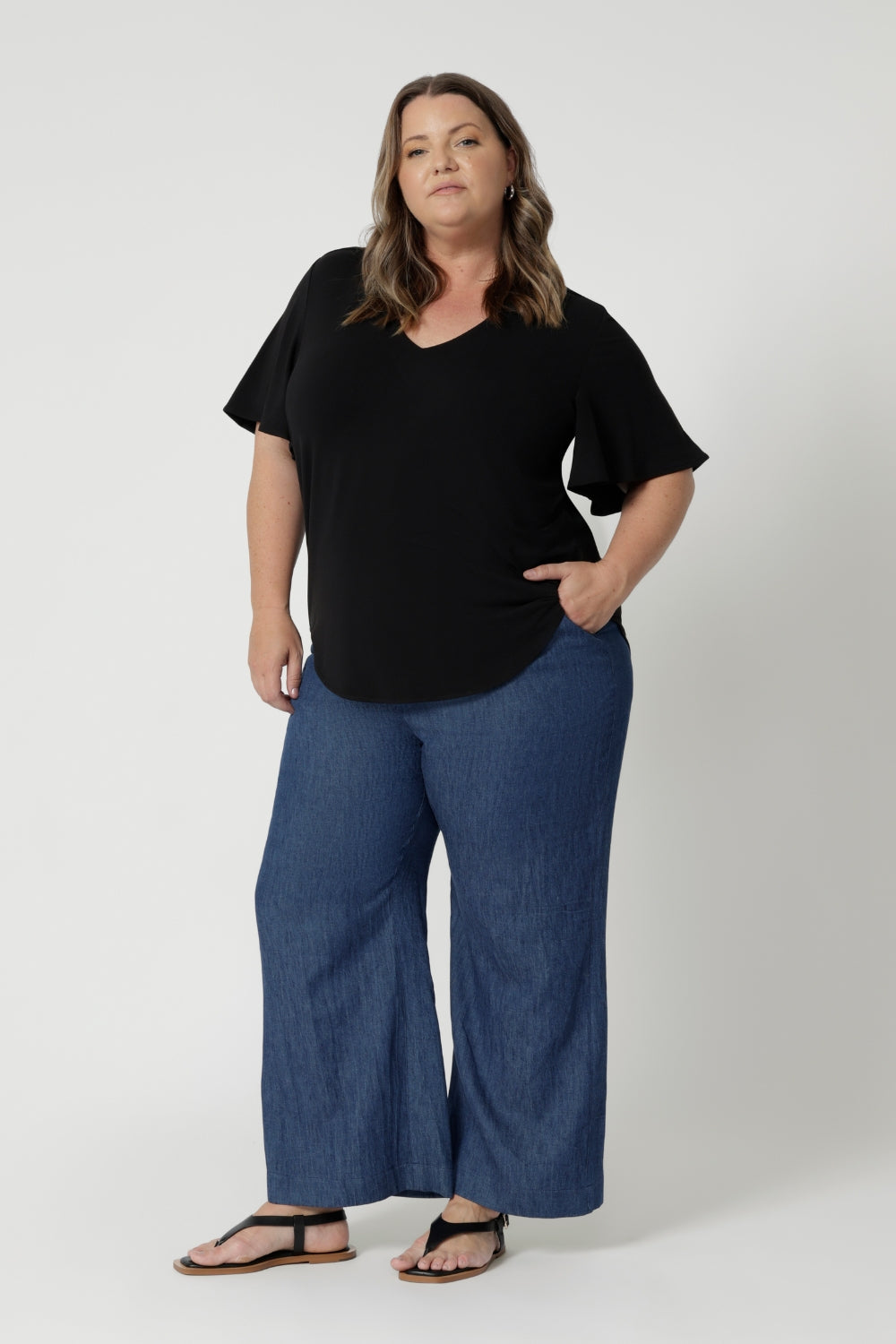 Available in sizes 8-24, it's designed to flatter a wide range of body shapes, ensuring that every woman feels confident and comfortable. Size 18 model pairs her Lila Top with denim jeans & flat sandal for a casual yet put together look.