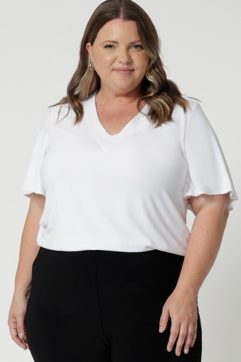 Perfect for travel, the top is lightweight, wrinkle-resistant, and easy to pack, making it a great companion for any getaway. Whether you're pairing it with jeans for a casual day out or dressing it up with a skirt and heels for a night out, this top offers endless styling possibilities. Available in sizes 8-24, it's designed to flatter a wide range of body shapes, ensuring that every woman feels confident and comfortable.