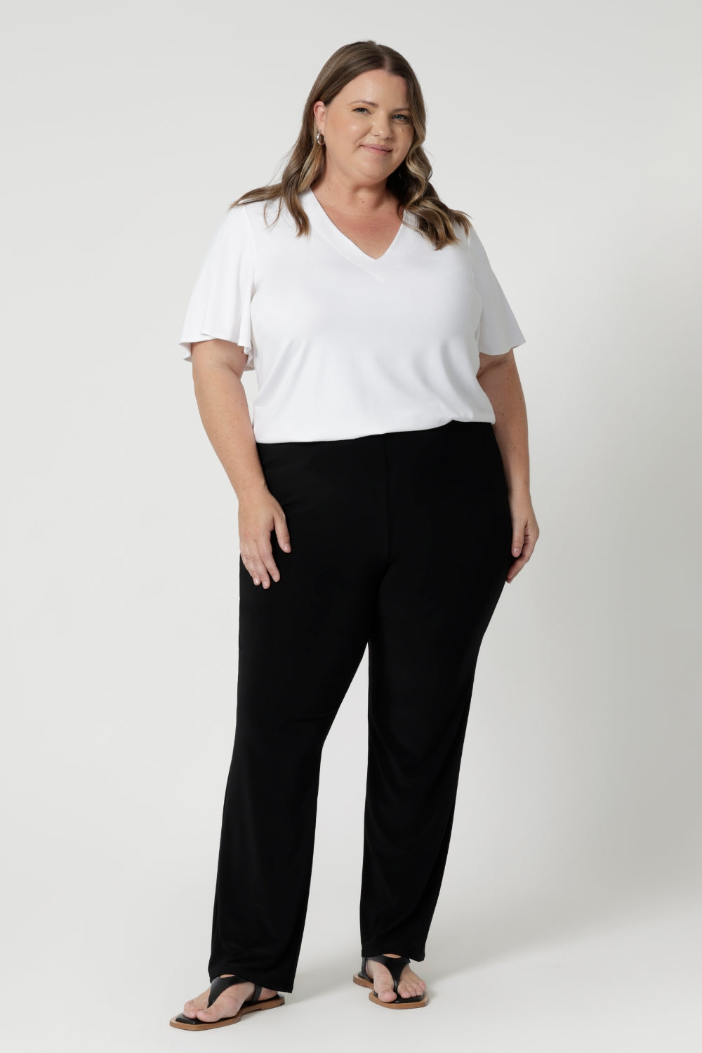 Crafted with both petite and plus-sized body types in mind, this flattering top has been crafted to fit most body shapes within the sizes 8-24. Must have staple for those seeking everyday comfort, style, and effortless versatility. Whether you're at the office or on the go, this flutter sleeved top will keep you looking polished and feeling comfortable all day long.