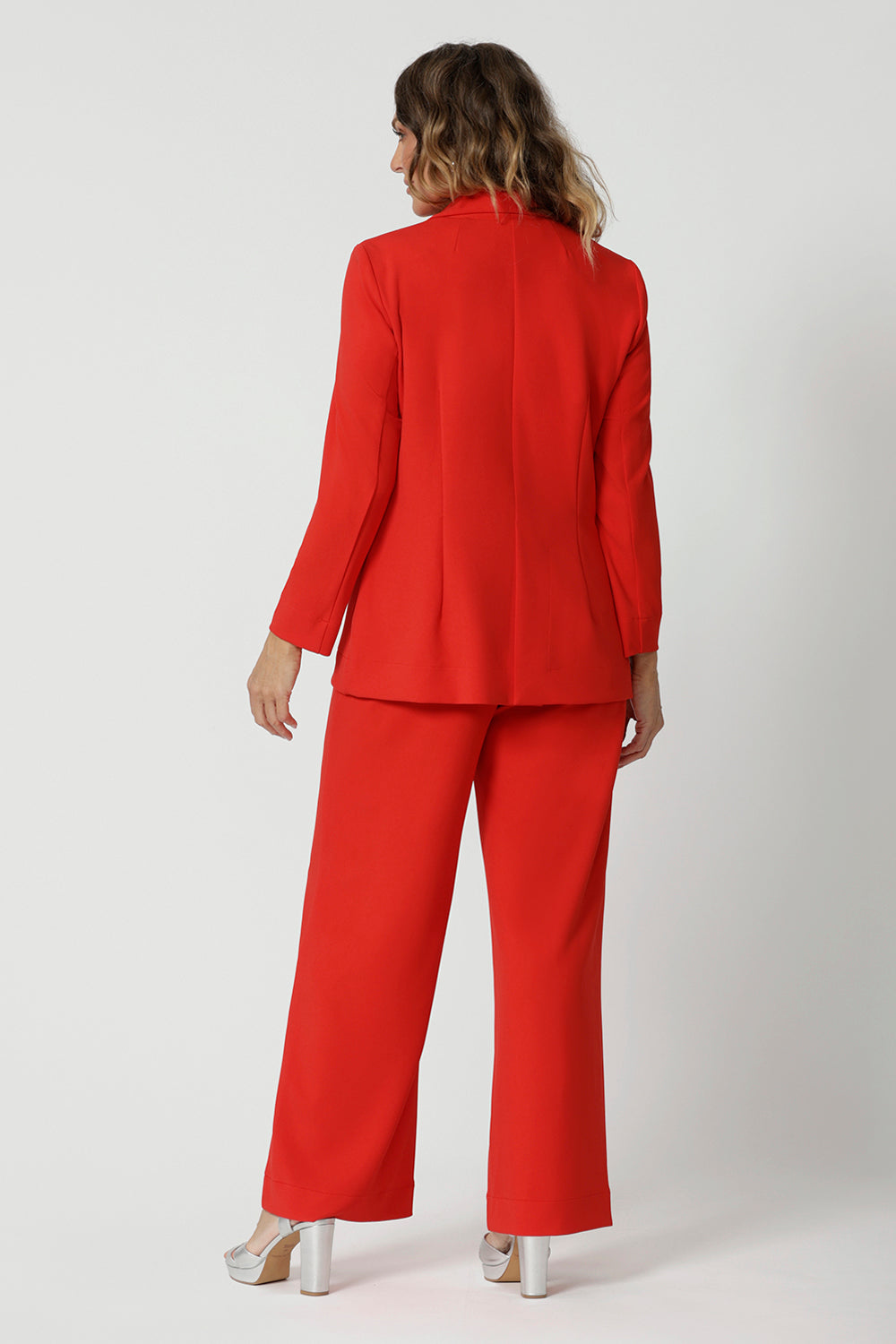 The longline, relaxed fit adds a contemporary touch, offering a sleek yet laid-back silhouette that's perfect for layering.
The blazer features an extended shawl collar that drapes beautifully, giving it a refined and elegant look. The button-up front adds a classic element to the design, while front pockets add both functionality and style.