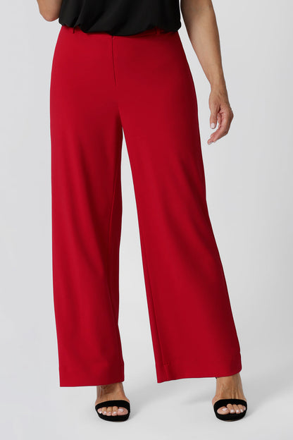 Close up of good pants for over 40s women,  the Drew pant in red is a high waist pant with wide legs. Tailored belt loops and wide leg. Made in Australia for by Australian fashion label, L&F. Stylish corporate wear for women. Made in Australia size 8 - 24. 