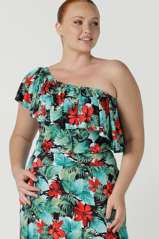 Off shoulder Briar Top in Havana on a size 12 model. Tropical print design with red flowers and green palm leaf. Soft slinky jersey. Wear this top multiple ways one shoulder, off shoulder and on shoulder. Made in Australia for women size 8 - 24.