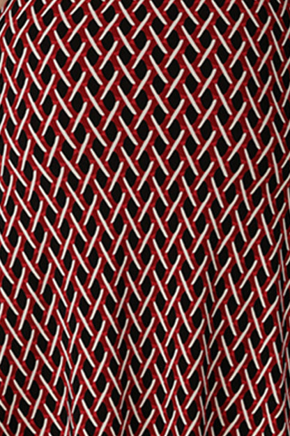 A swatch of red, vanilla and black 'Chevron' print fabric used by Australian fashion brand, Leina & Fleur to make a graphic print dress for work.