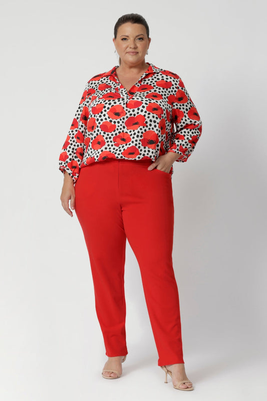 In a bold and vibrant bright tangerine hue, these pants are perfect for those who want to add a pop of colour to their workwear while maintaining a professional appearance. Whether paired with a simple blouse or a structured blazer, these pants offer both comfort and style for the modern woman.