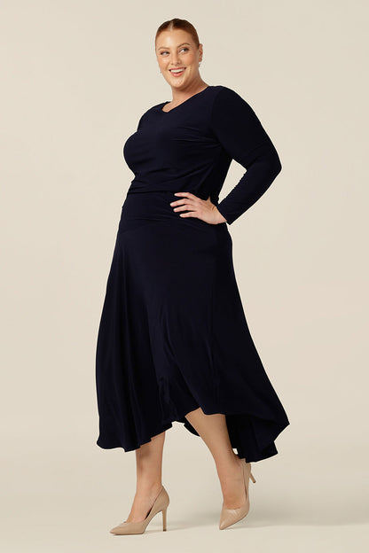 Giving a contemporary look, the asymmetric hem of this navy jersey skirt adds volume to her midi-length. Shop as a work skirt or a casual skirt, the navy blue colourway creates classic style that wears well as skirt for work or play.