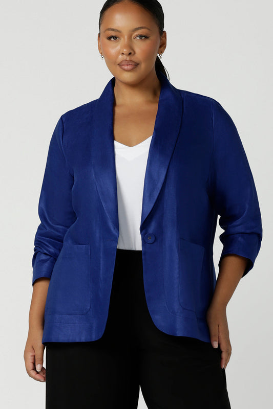 Houston Blazer in Cobalt Linen size 16. Softly tailored in Linen with front pockets and a functioning button front. Made in Australia for women size 8 - 24. Styled back with white Eddy cami top. 
