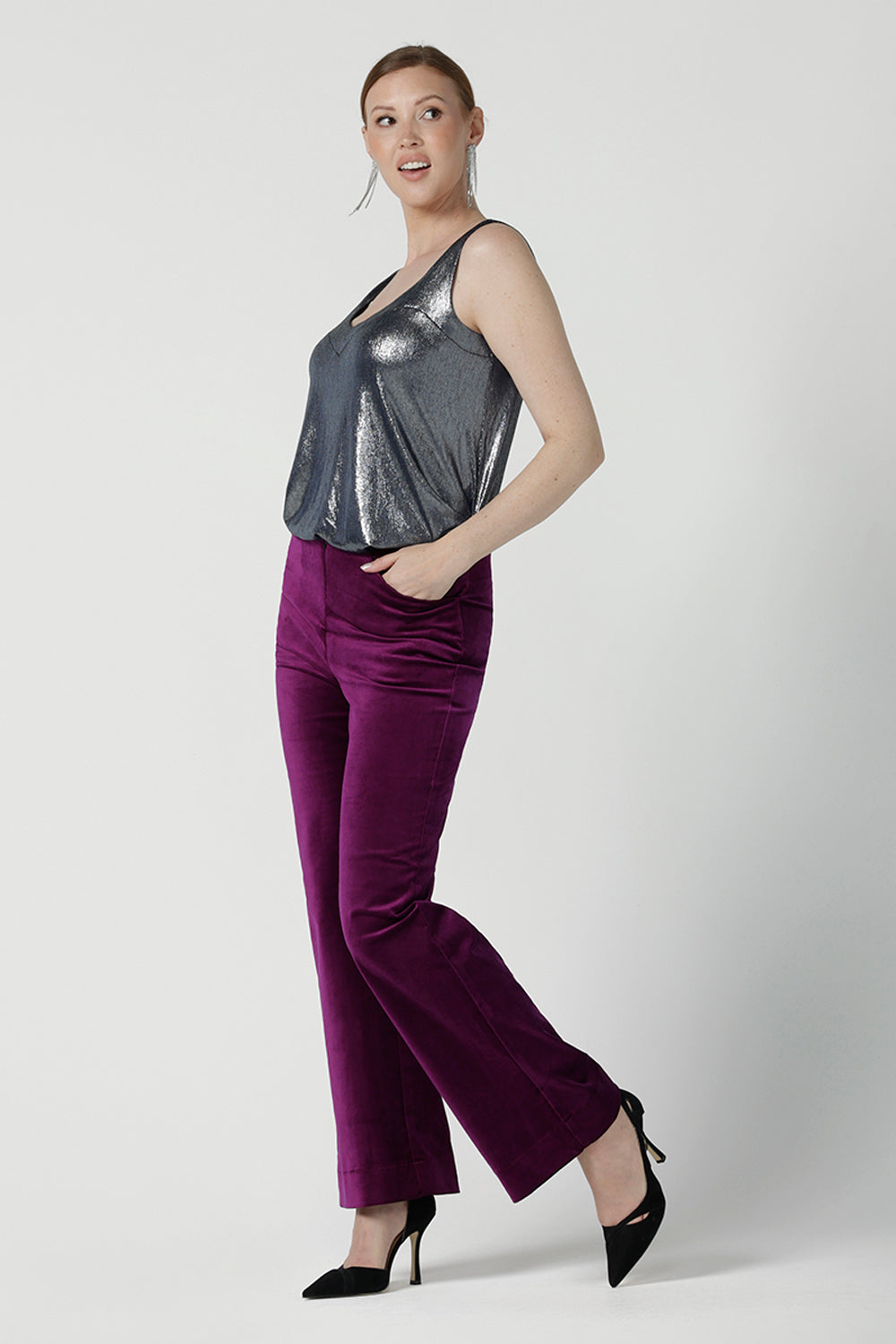 Back view of a size 10 woman wears the Jonas pant in Magenta Velveteen with a kick flare. The perfect cocktail suit set. Made in Australia for women size 8 - 24. Styled back with the Eddy Cami in Twilight.