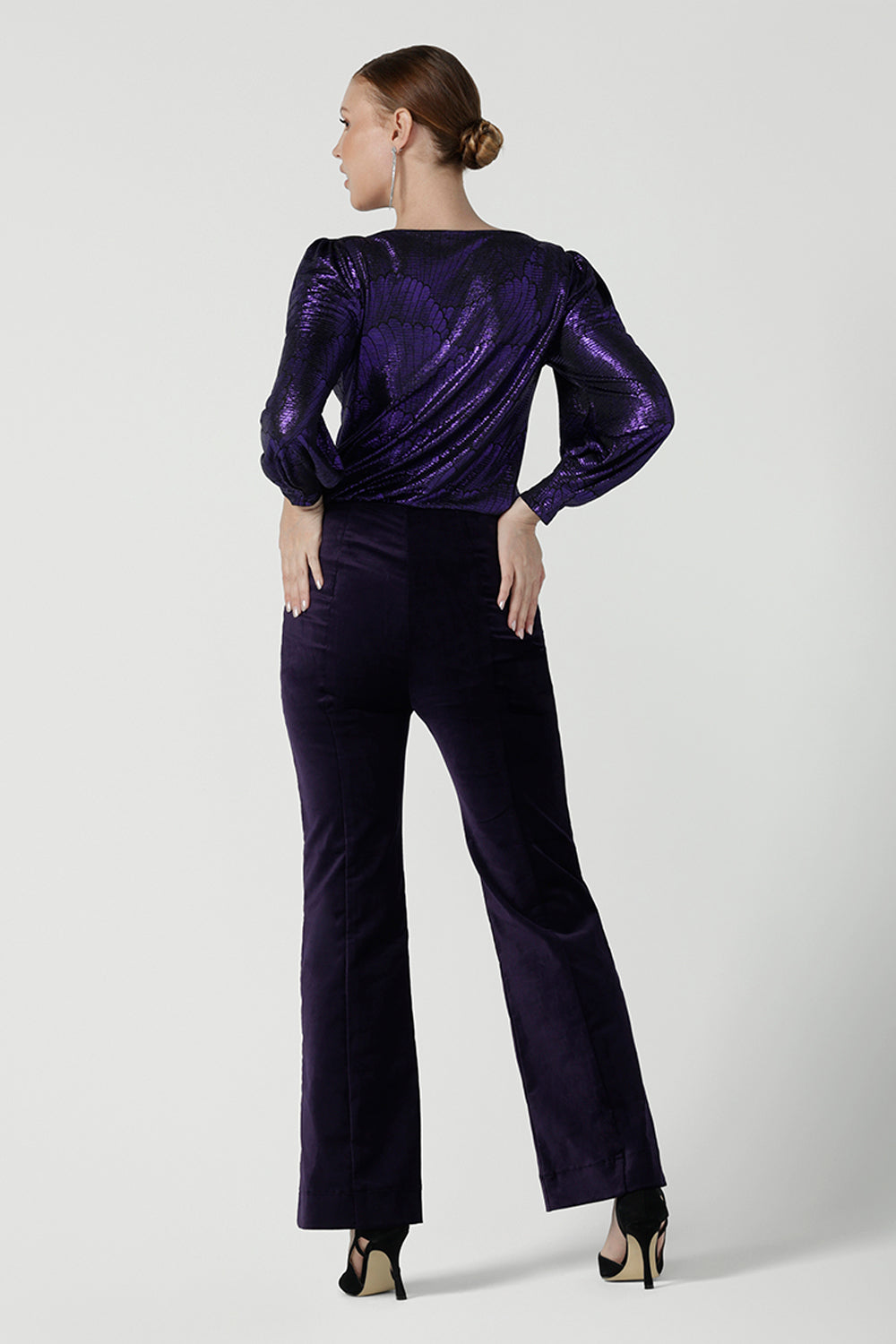 Back view of the Jonas pant in Purple Velveteen is a kick flare pant made in purple velveteen fabric. Cocktail pant suit sets. Made in Australia for women size 8 - 24.