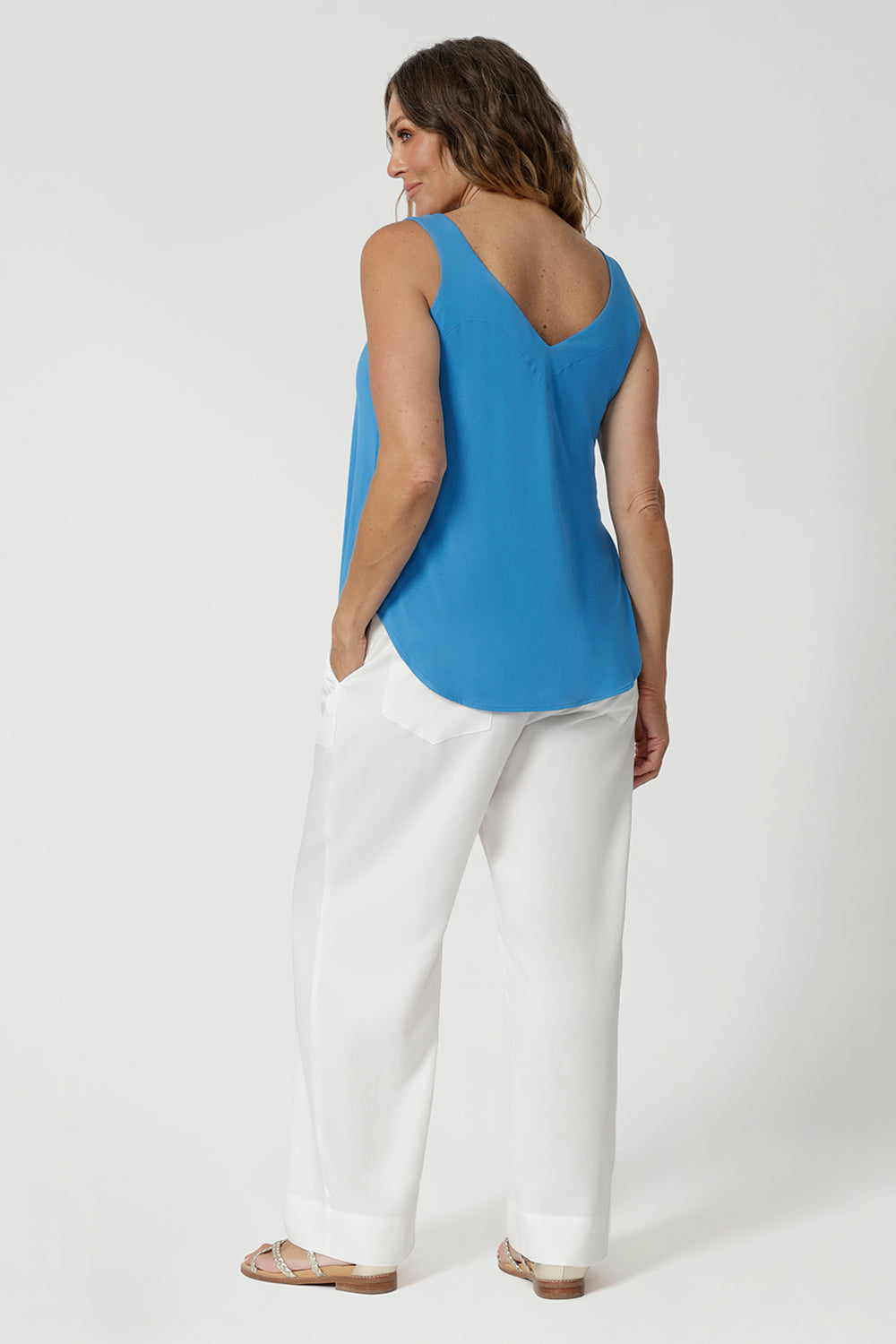 Woman's summer cami features a graceful V-neckline both in the front and the back, adding a touch of sophistication and subtle femininity to the overall look. Summer ready top is available in sizes 8-24. Fashion brand Leina & Fluer proudly stock petite and plus sizes. 