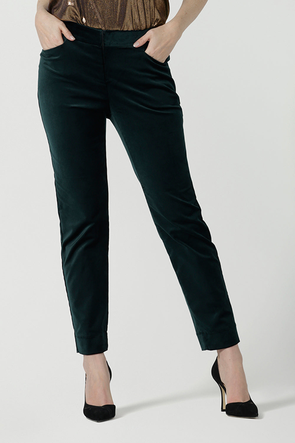 A size 10 woman wears the Jonas Pant in green velveteen. A made in Australia velveteen pant styled back with the Eddy cami in Bullion Xanadu. 