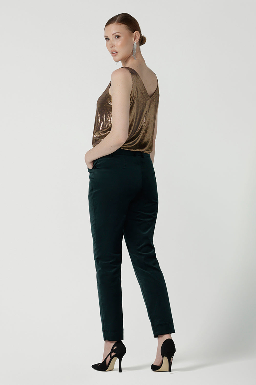 Back view of a size 10 woman wearing the Jonas Pant in green velveteen. A made in Australia velveteen pant styled back with the Eddy cami in Bullion Xanadu.