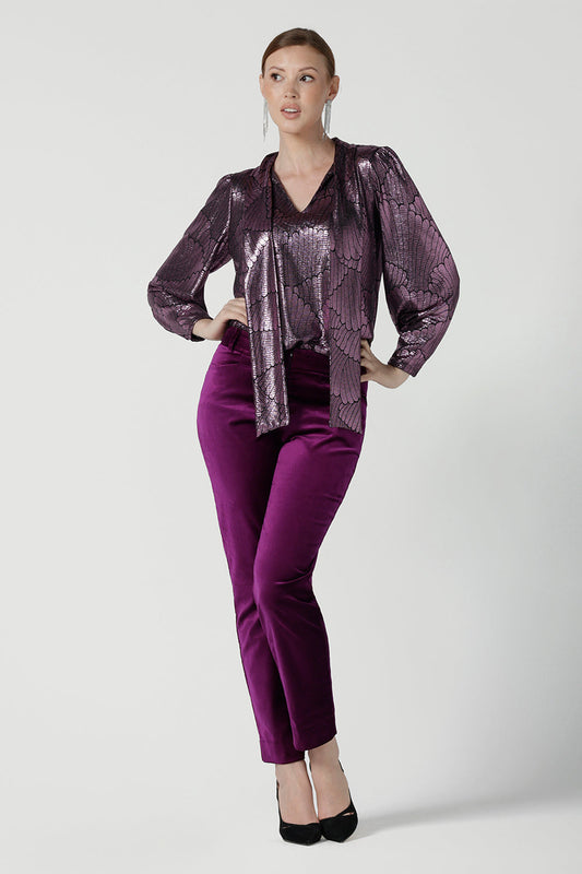 A size 10 woman wears the Keaton Pant in Magenta. Cocktail suit sets for women. Made in Australia for women size 8 - 24. For petite to plus size women made in Australia. 