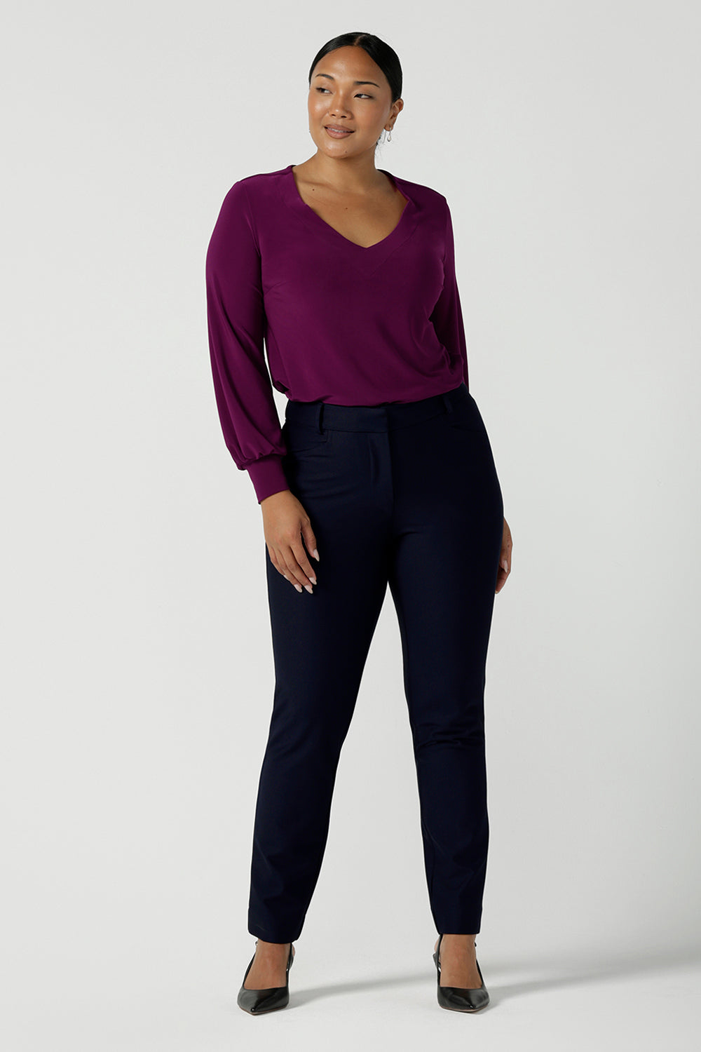 Lulu tailored pant in Navy. Made in Australia for women. Made in Australia for women size 8 - 24. A tailored pant in Navy with waistband and fly front with pockets. Styled back with the Avery top in Magenta. Proudly made in Australia. 