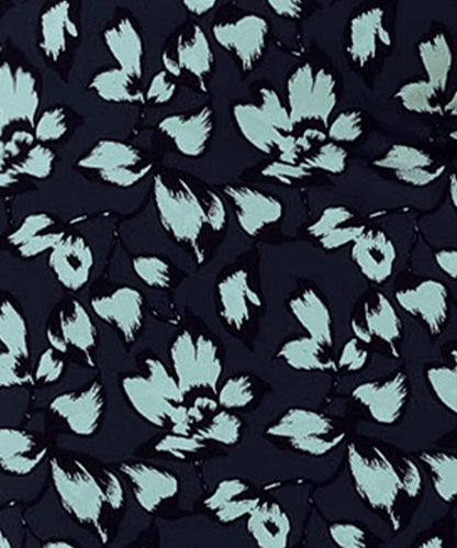 Image shows a swatch of aqua blue floral print on navy blue dry touch jersey fabric, used by Australian and New Zealand women's clothes label, Leina & Fleur to make a collection of wrap dresses and workwear tops.