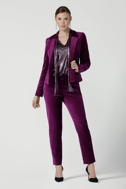 A size 10 woman wears the Keaton Pant in Magenta. Cocktail suit sets for women. Made in Australia for women size 8 - 24. For petite to plus size women made in Australia. Styled back with the Sasha Jacket in velveteen. 