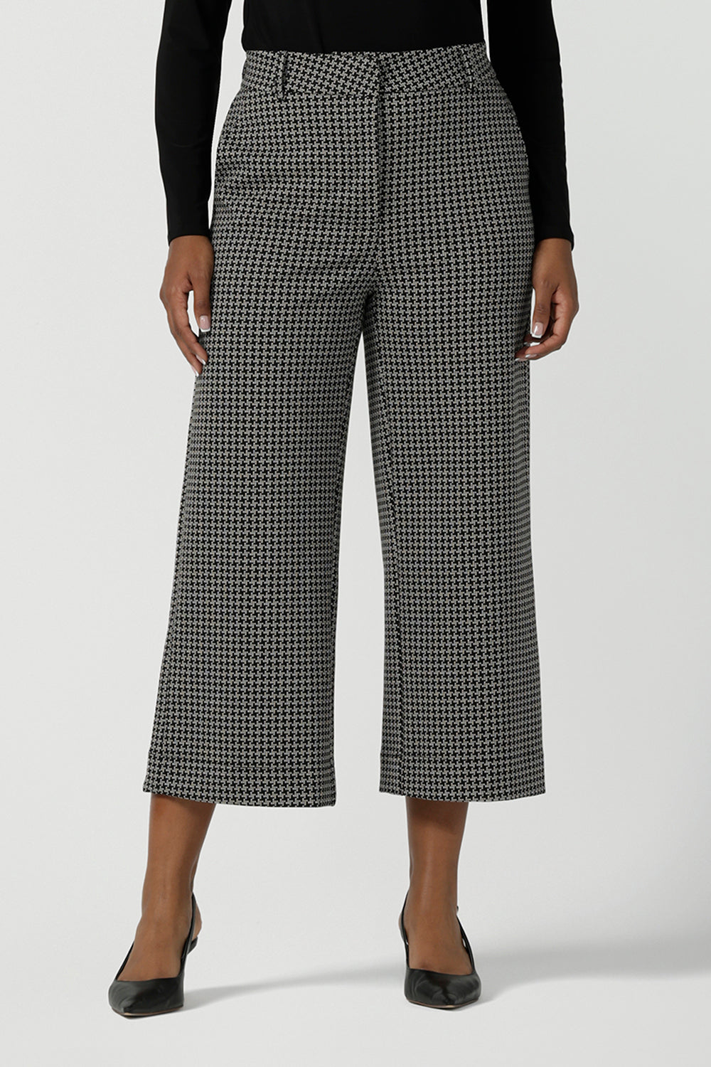 Front view of a size 10 woman wears the Yael Pant in Jacquard. Styled back with the Ellis Shirt in Black Tencel. A textured jacquard knit suit set. Made in Australia for women size 8-24