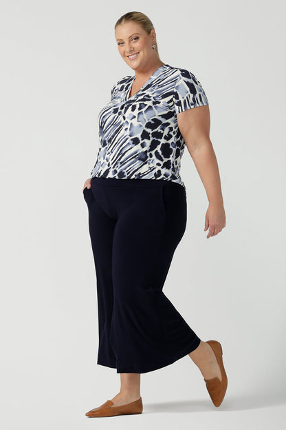 A good top for plus size women, this short sleeve V-neck top is tailored to fit women's curves. A blue and white print jersey top, this Australian-made top is worn with wide leg, navy blue pants for work and casual wear. Shop online in inclusive sizes 8 to 24 at Australian women's clothes brand, Leina & Fleur