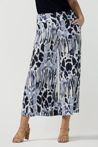Cropped, wide leg culotte pants in blue and white print are shown on a size 10, 40 plus woman. Great summer pants, these culottes are easy care trousers and are comfortable as work wear pants or for casual wear. Made in Australia by Australian women's clothing brand, Leina & Fleur.