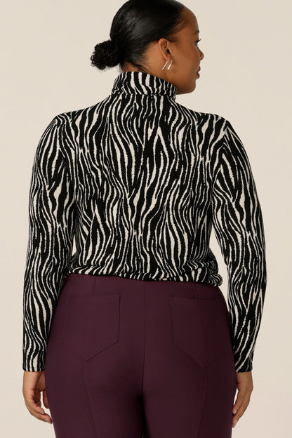 Back view of a long sleeve, turtle neck top in black and white zebra print jersey, in a size 18. Made in Australia by Australian and New Zealand women's clothing brand, L&F, shop this work top in sizes 8 to 24.