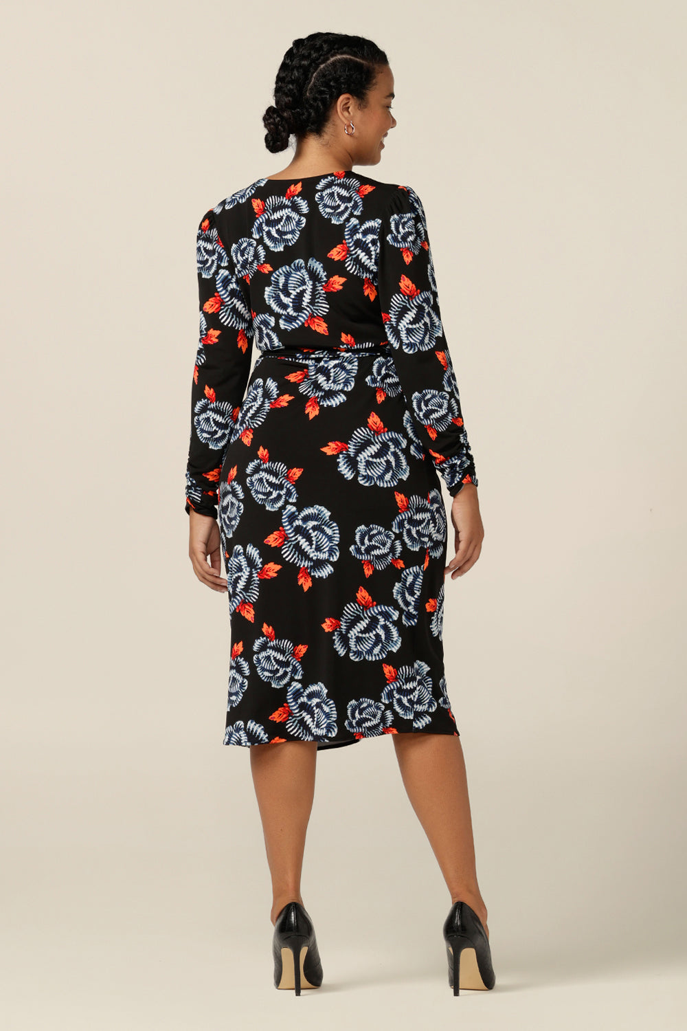 Back view of a jersey wrap dress crafted with Australian-made expertise, this wrap dress features ruched details, flattering tulip skirt and long sleeves. Designed for women in sizes 8 to 24, this dress is good for work wear and smart-casual style.