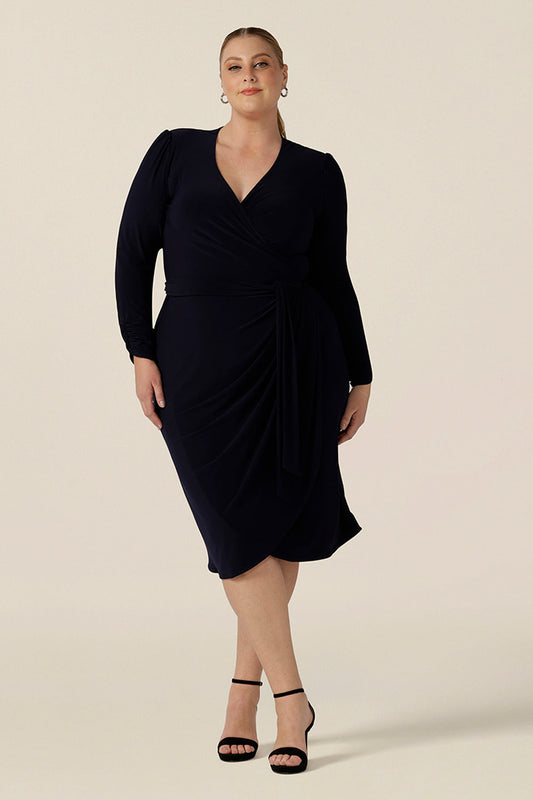 A flattering shape for fuller figures, this navy blue jersey wrap dress by Australia and New Zealand's leading wrap dress brand, L&F has a tulip skirt and long sleeves with gathered sleeveheads. In size 18, this dress showcases the inclusive size range of L&Fs Australian-made wrap dresses, which come in a size 8 to 24 size range. 