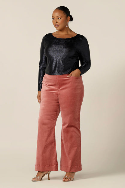 Evening and cocktail wear for plus size women gets a touch of disco fever with these flared leg, tailored pants in musk pink velveteen. Worn with a sparkly, long sleeve top in midnight blue for eveningwear, these special event pants are made in Australia in sizes 8 to 24, petite to plus sizes.